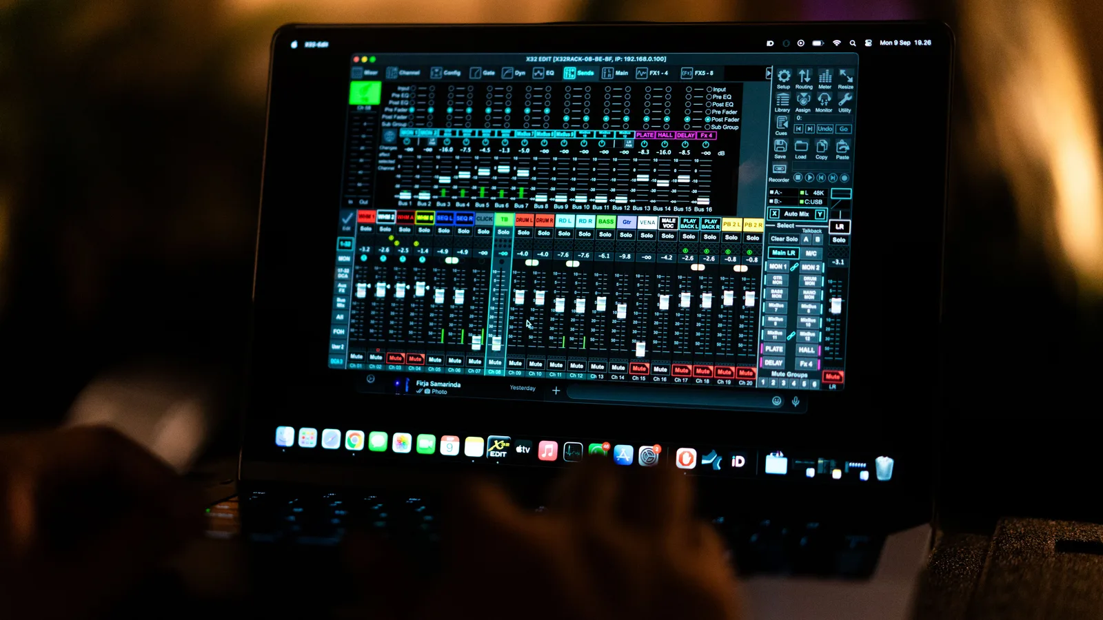Close-up of a digital audio mixing software interface on a laptop screen in a recording studio. Podcast editor contract clauses US creators should review