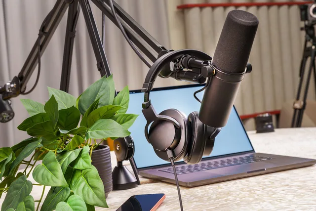 A modern podcast studio setup with a microphone, headphones, and laptop, ideal for media production and online broadcasting. Break-even for a podcast business, worked through